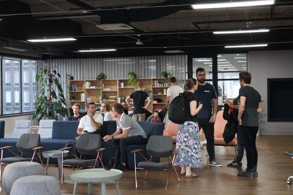 Meetup members attending the DesignOps meetup, standing around