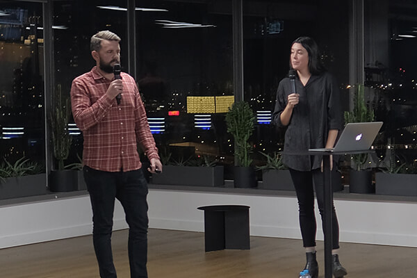 John and Mel speaking on-stage
