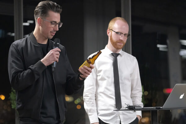 Ch'an drinking beer up on stage