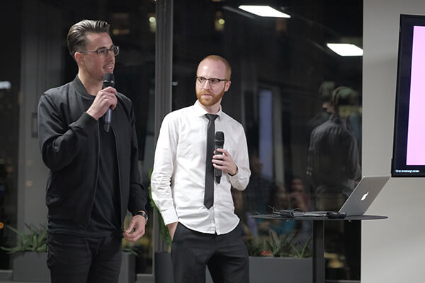 Ch'an and Adam hosting the event on stage