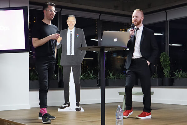 Ch'an and Adam standing on stage