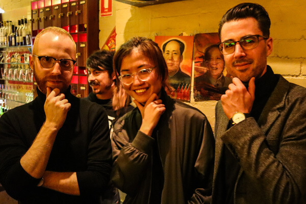 Ch'an, Adam and Shuying doing a Steve Jobs pose while wearing turtlenecks